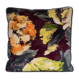 Decorative pillow with abstract floral design on an aubergine background