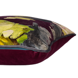 Decorative pillow with abstract art design on a deep purple background