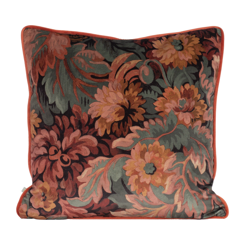 Decorative velvet pillow with a traditional floral pattern in pinks and deep reds
