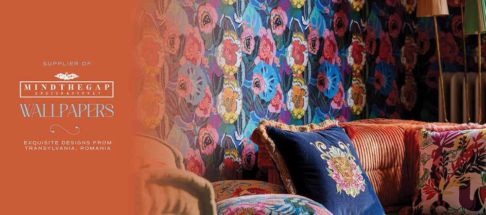 Wallpaper with floral design in a room setting, featuring Mindthegap Wallpapers branding.