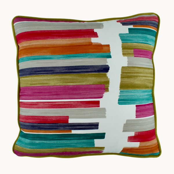 Photo of a brightly coloured cushion with painterly brushstroke lines