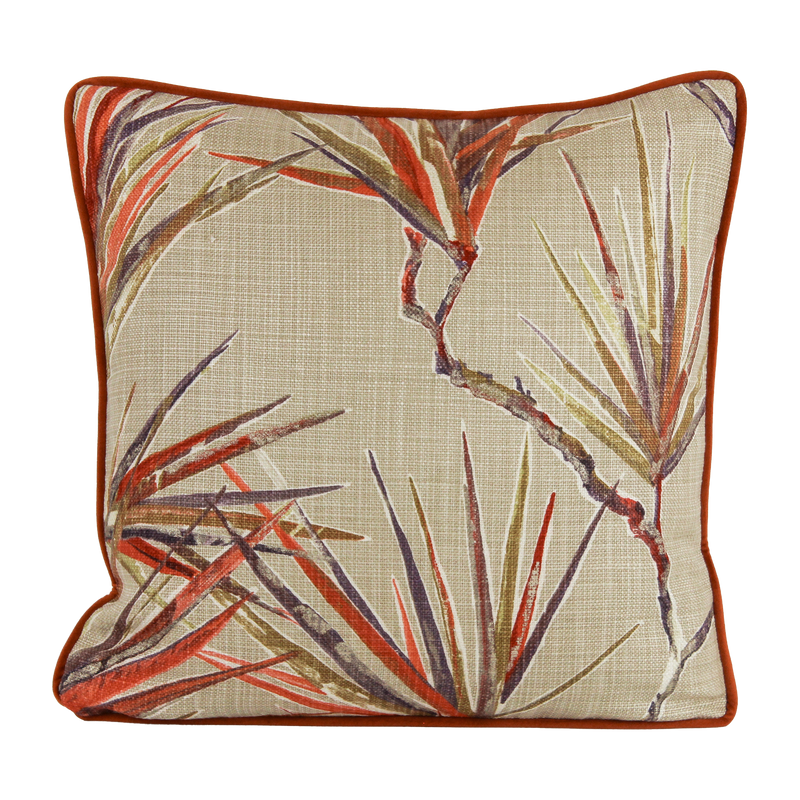 Decorative pillow with leaf pattern on a beige background