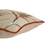 Decorative pillow with floral pattern and brown border on a white background