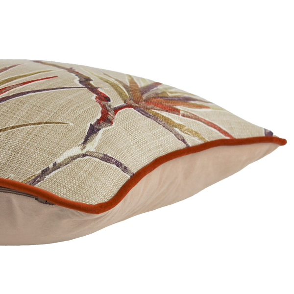 Decorative pillow with floral pattern and brown border on a white background