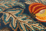 Close-up of a patterned fabric with leaves and melons on a blue background