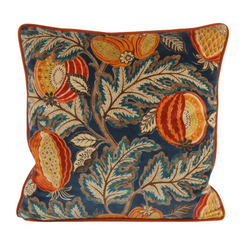 Decorative cushion with floral and fruit pattern on a blue background