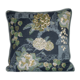 Decorative pillow with floral pattern on a dark blue background