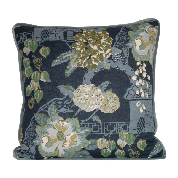 Decorative pillow with floral pattern on a dark blue background
