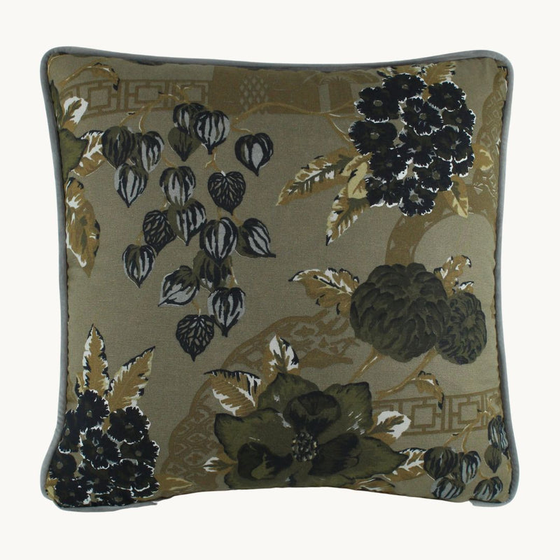 Photo of a cushion with a deep muddy green base colour, plus khaki black and grey oriental designs