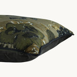 Photo of a cushion with oriental designs in khaki, olive and black.