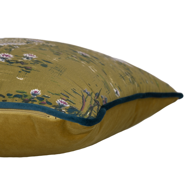 Side shot of a cushion with white swans and flowers on an olive coloured base