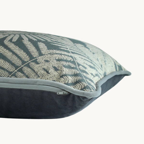 Side shot of a botanical cushion with silver ferns