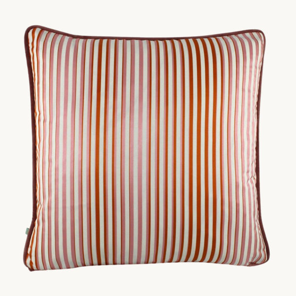 Photo of a striped cushion in orange and pink