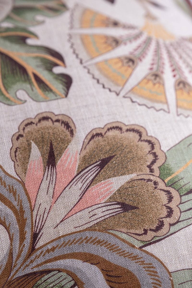 Close up of a floral linen in pinks and muted colours