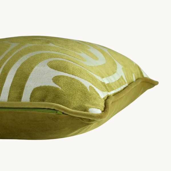 Side shot of a lime cushion with a large scale 70s inspired floral design