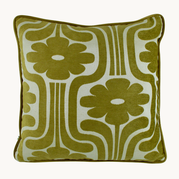 Photo of a lime coloured cushion with a large scale 1970s inspired floral design