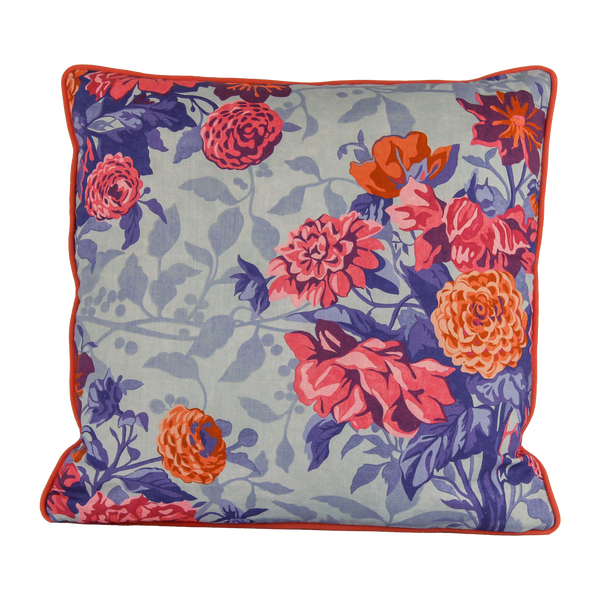 Floral patterned cushion with  pink, coral and orange dahlias on a light blue background