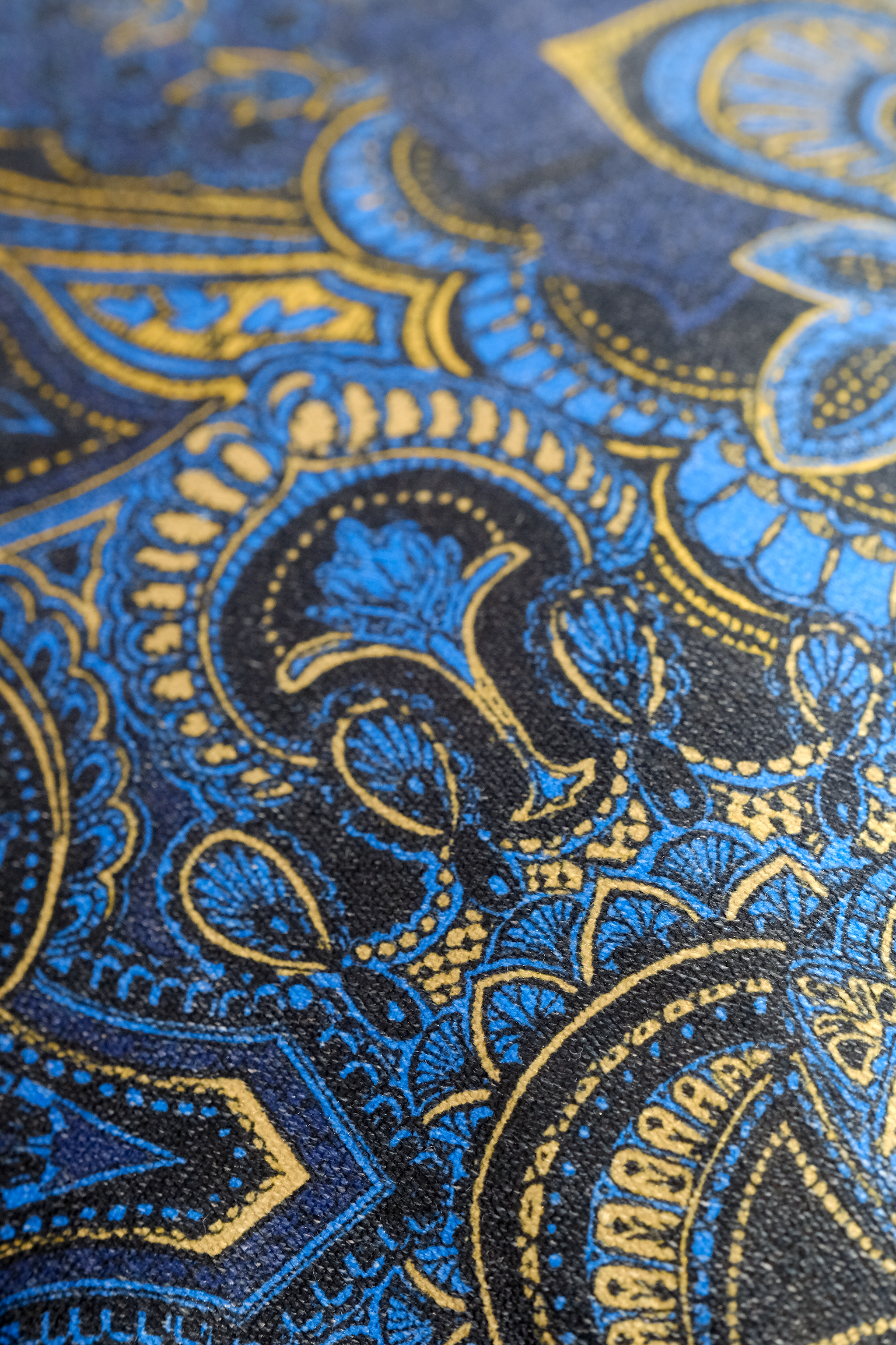 Close-up of blue and gold paisley damask pattern