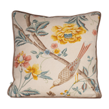 Decorative cushion with floral and bird design on a linen background