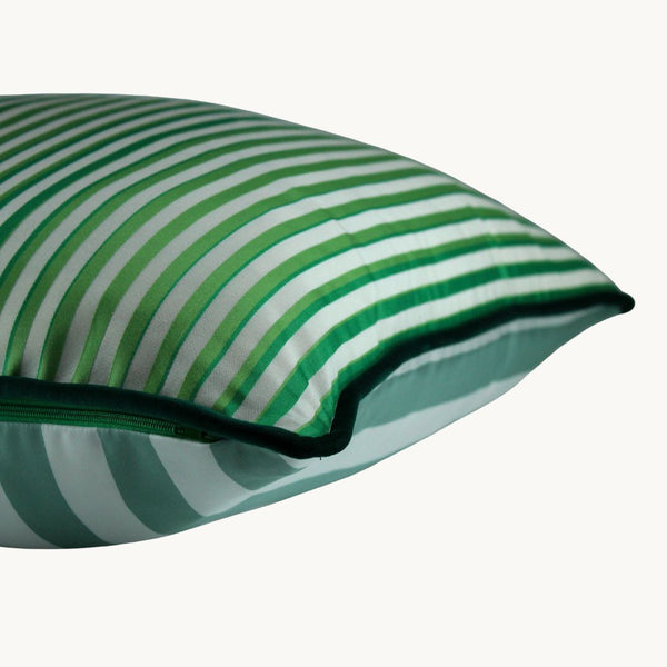 Side shot of a striped cushion in greens