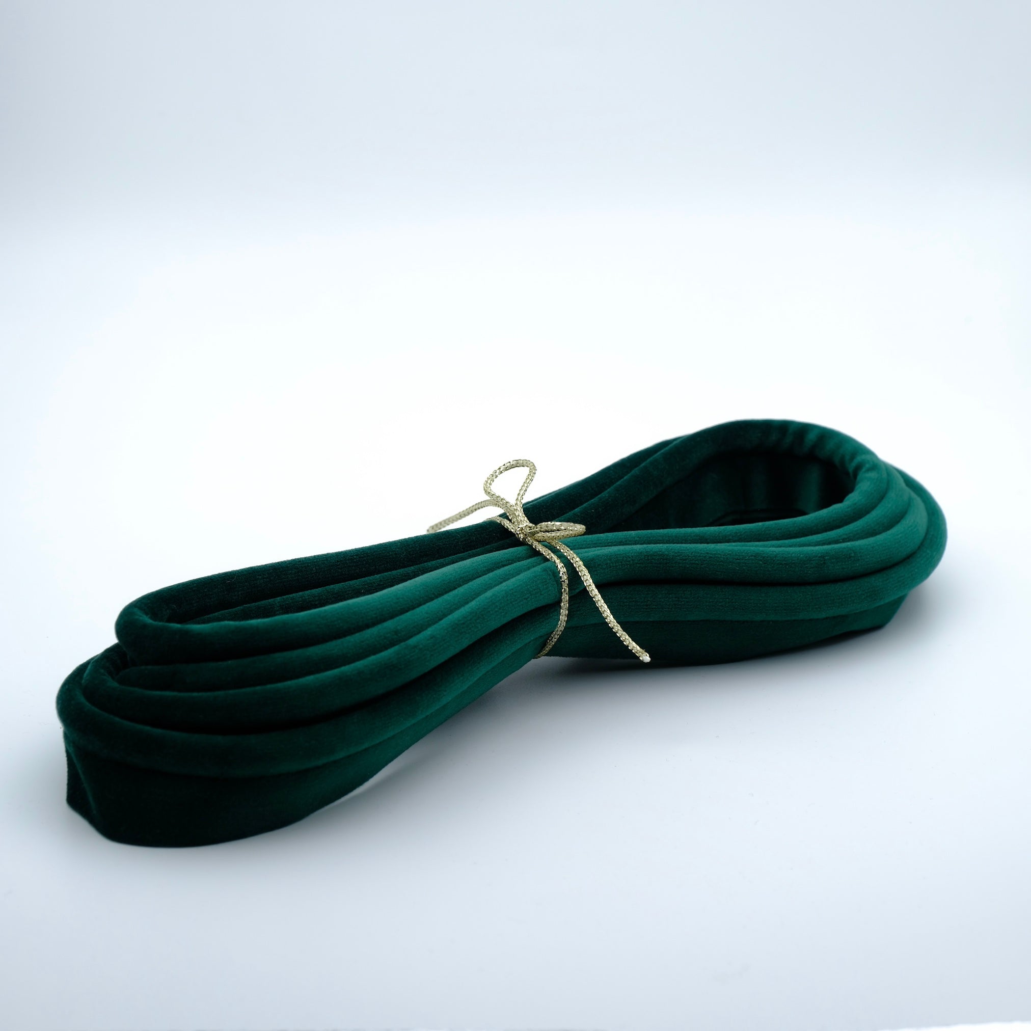 photo of a bundle of emerald green velvet piping cord