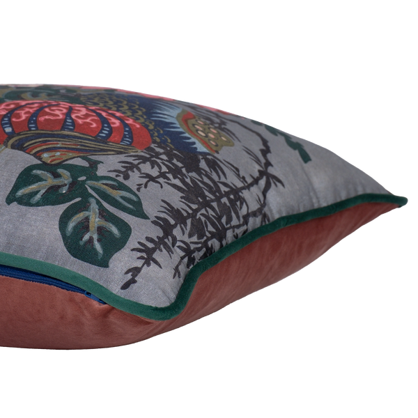 Side shot of a decorative floral cushion with large boquet of flowers in grey pink red navy and aquamarine.