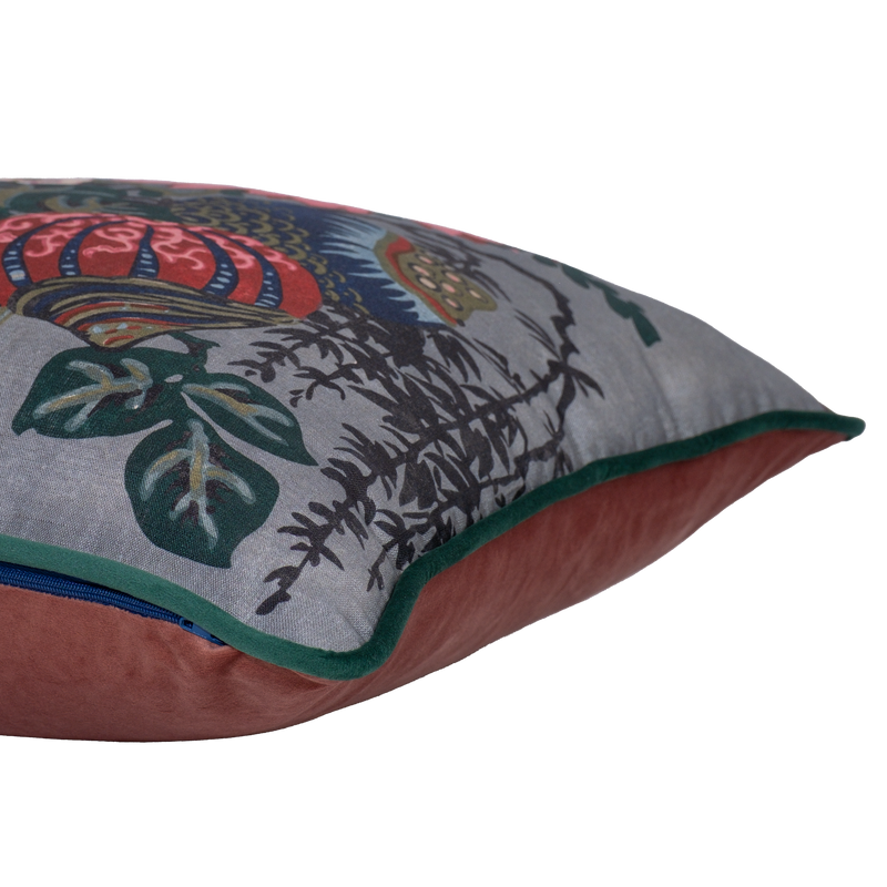 Side shot of a decorative floral cushion with large boquet of flowers in grey pink red navy and aquamarine.