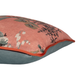 Side shot of a decorative linen cushion with a large boquet of flowers in salmon, red, duck egg blue and rich brown.