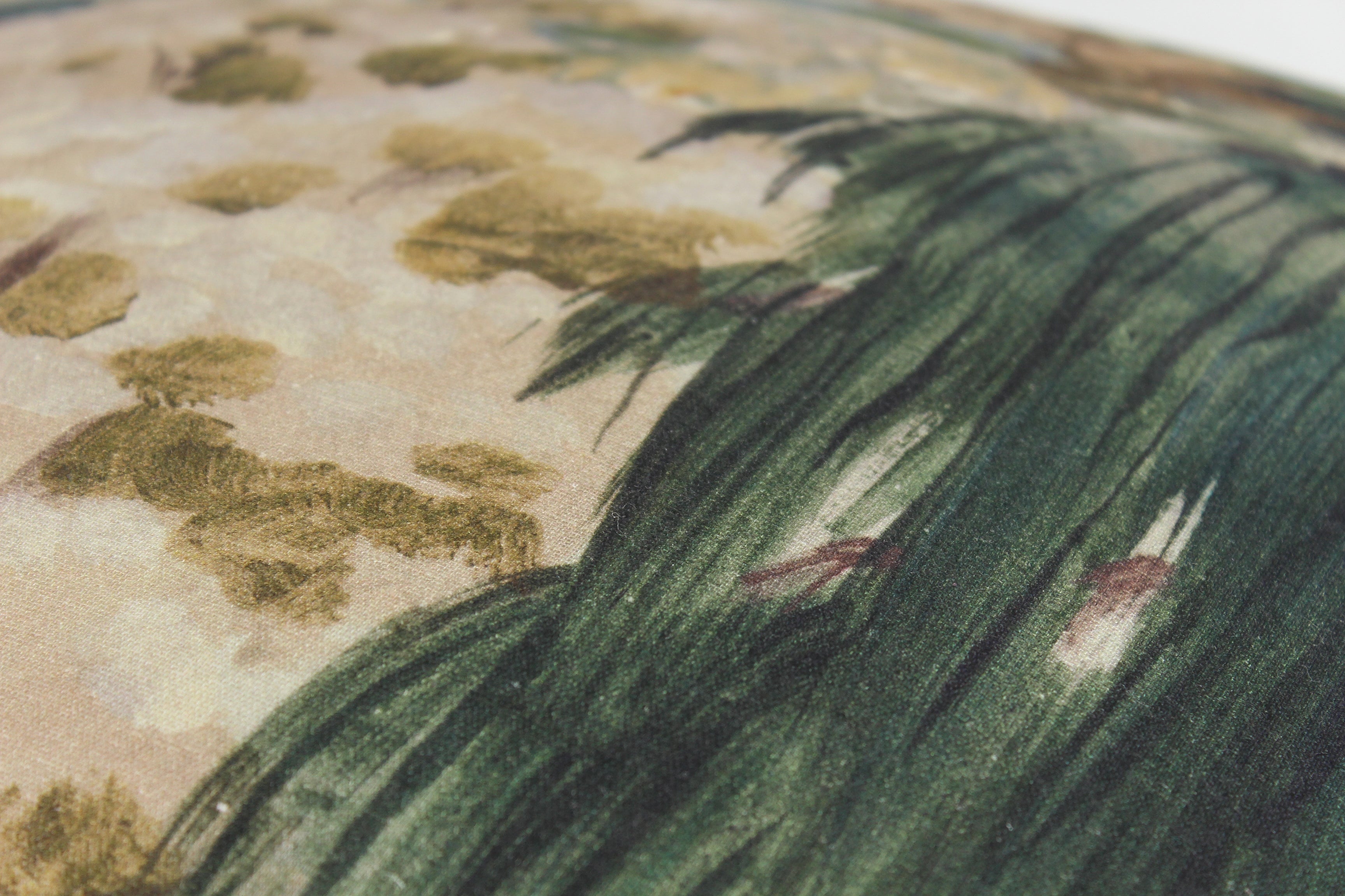 Close-up of a fabric with green foliage  in a painterly style