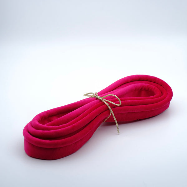 Photo of a bundle of fuchsia pink velvet piping