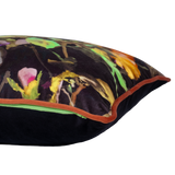 Decorative pillow with colorful floral pattern on a black background