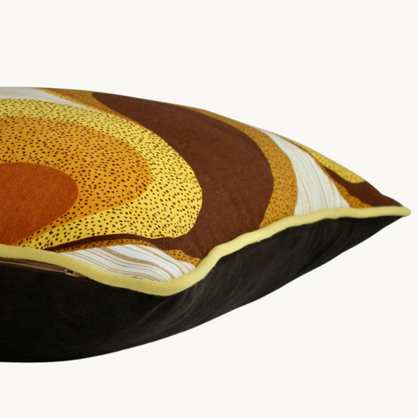 Side shot of a cushion with an iconic 1970s geometric design