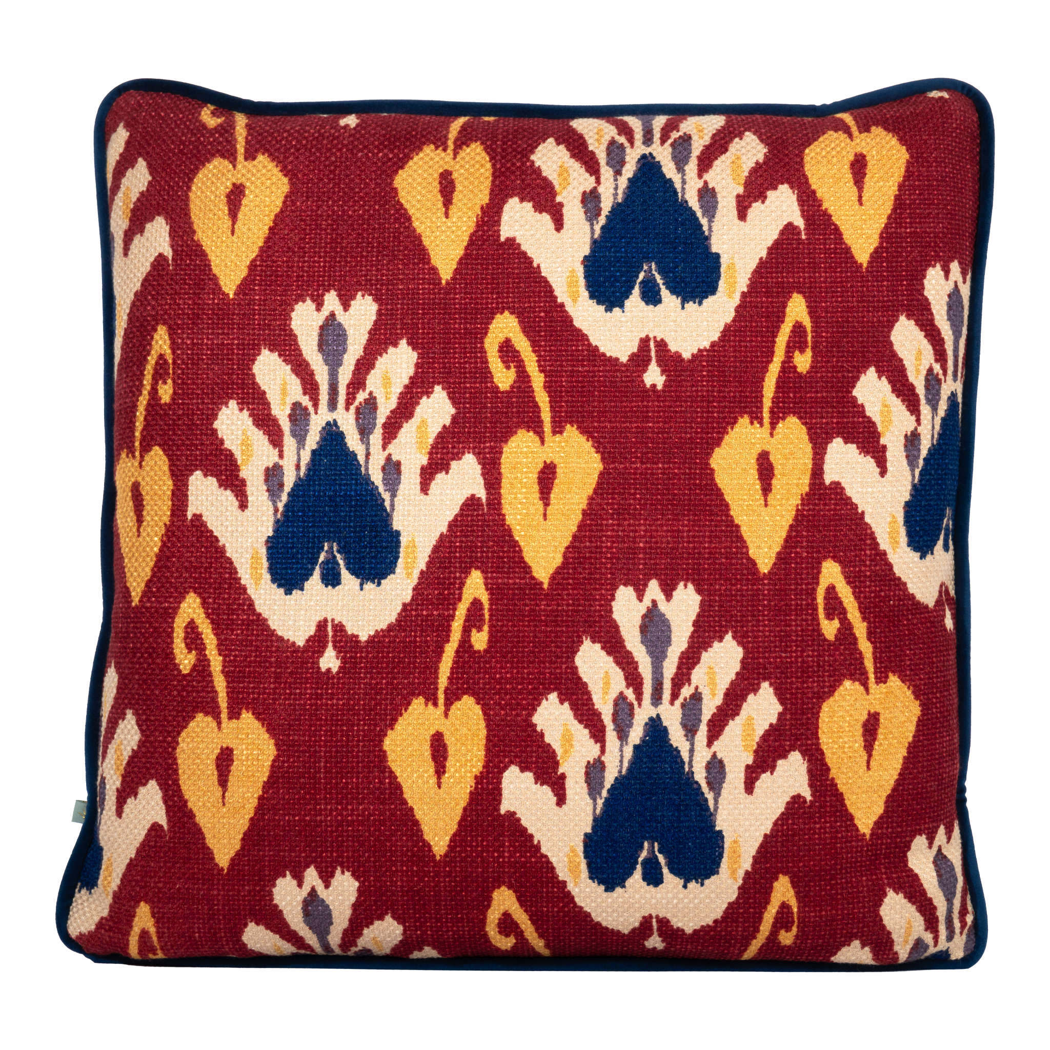 Cushion with an ikat pattern in a deep russet colour with navy and yellow accents