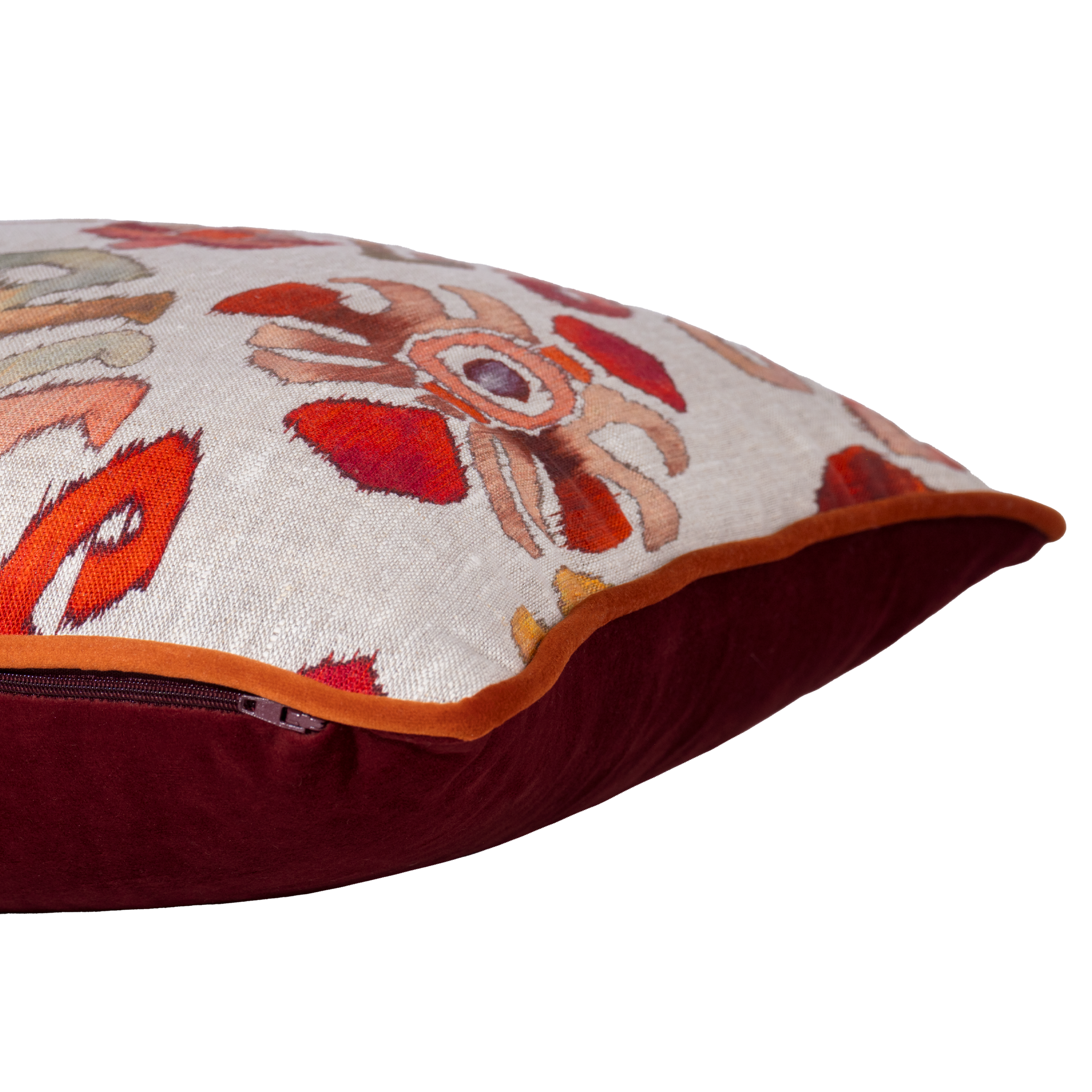 Decorative cushion with an ikat pattern on a natural linen background