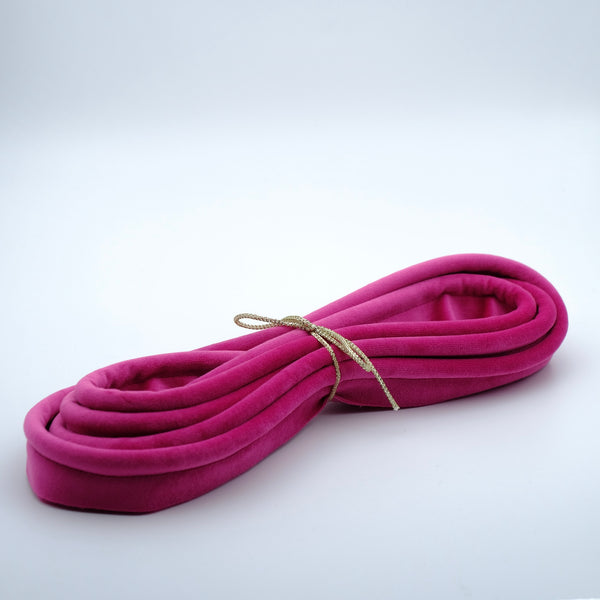 Photo of a bundle of hollyhock hot pink velvet piping cord