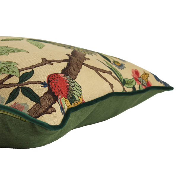 Decorative pillow with bird and branch pattern on a beige background