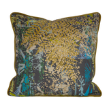 Decorative cushion with botanical silhouettes in multiple colours on a grey background