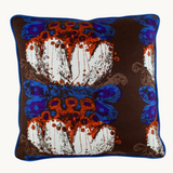 Photo of a cushion made from a 1970 vintage fabric reminiscent of german pottery.