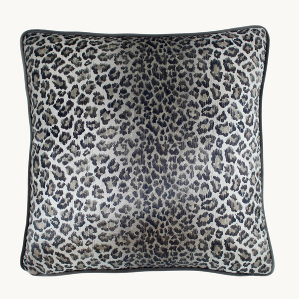 Photo of a cushion made from a leopard print velvet in cool silver tones