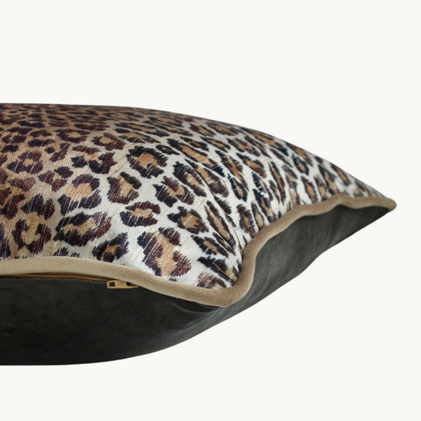Side shot of a cushion made from warm toned leopard print velvet