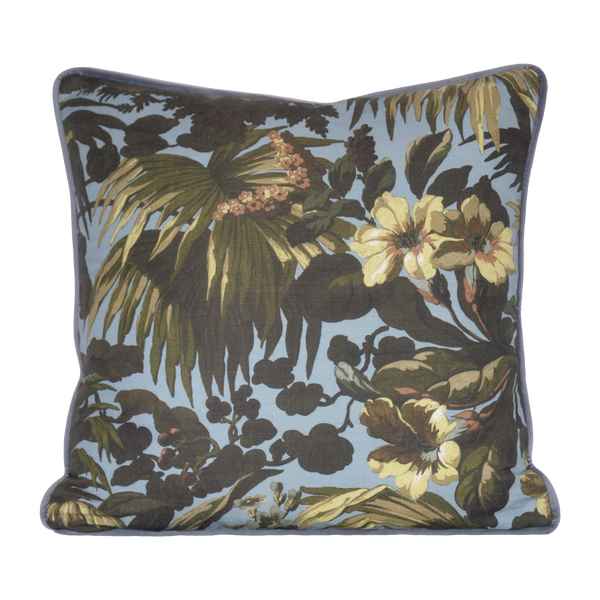 Floral and leaf patterned cushion on a light blue background