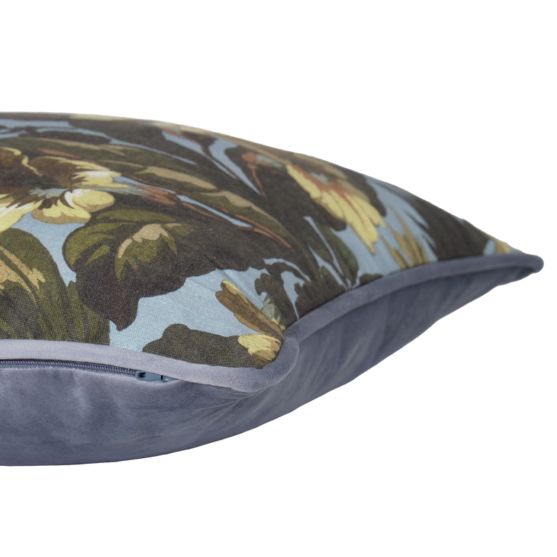 Decorative cushion with floral pattern on a light blue background