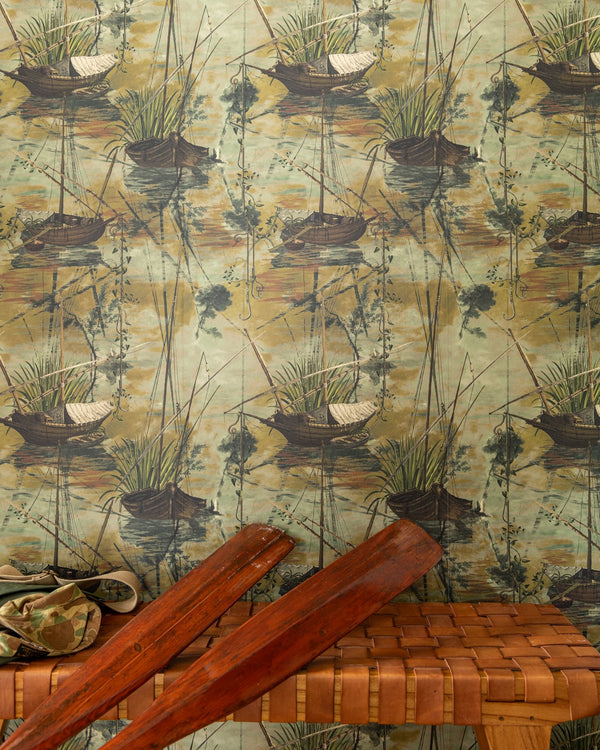 A cozy entryway with vintage boat-themed wallpaper, a woven bench, wooden oars, and rugged outdoor gear, evoking a nostalgic maritime feel