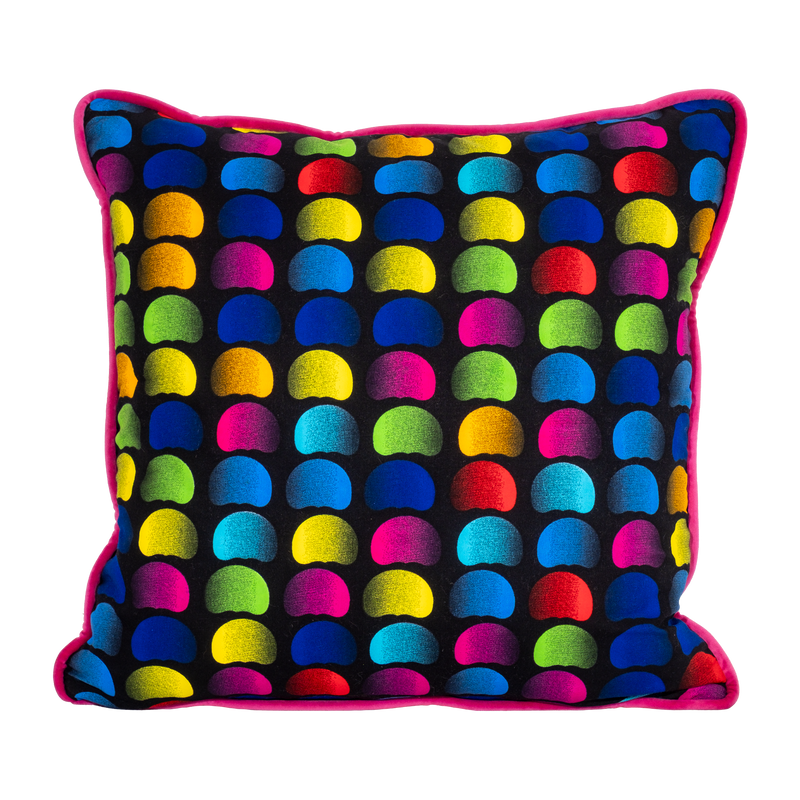 Neon bright cushion with rainbow of coloured beans on a black background