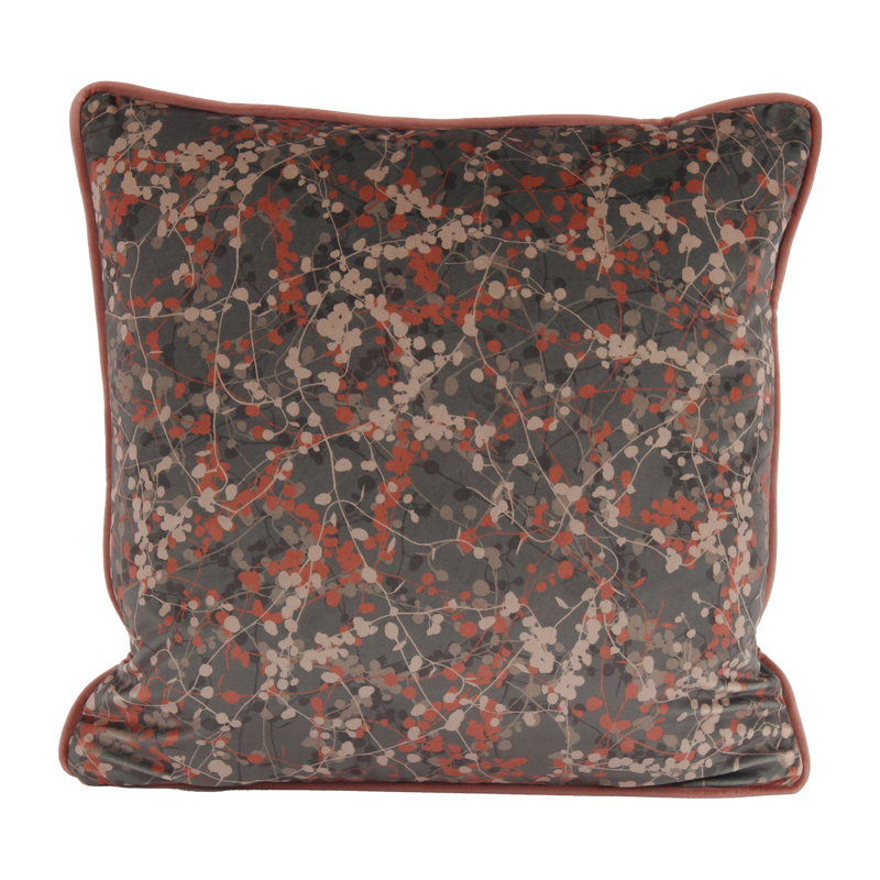 Velvet cushion with delicate leafy vines in mole and clay colours.