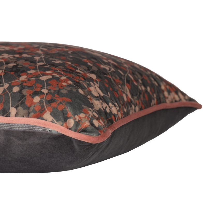 Velvet cushion with delicate leafy vines in mole and clay colours.