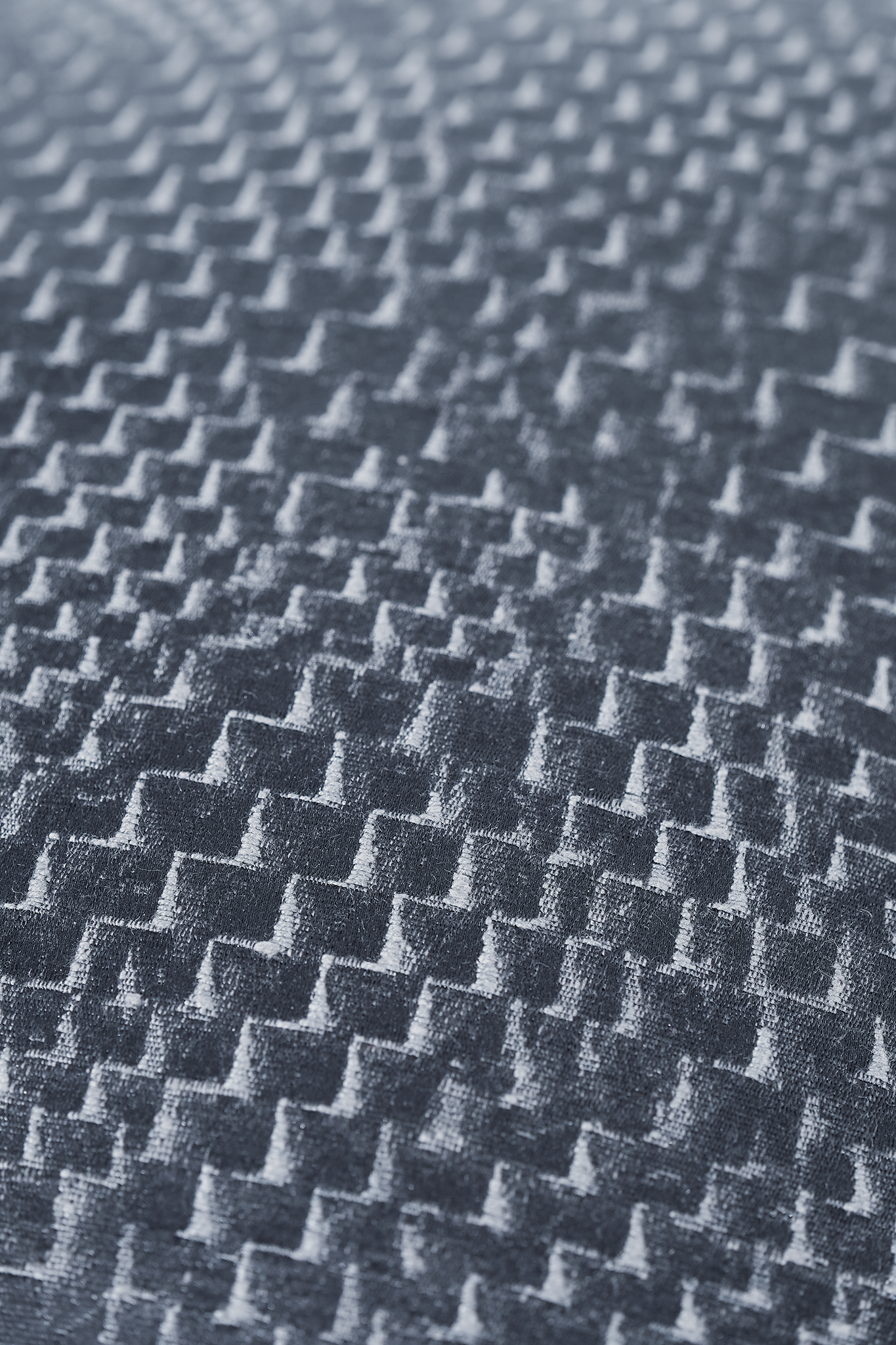 Close up of a dark navy textured fabric