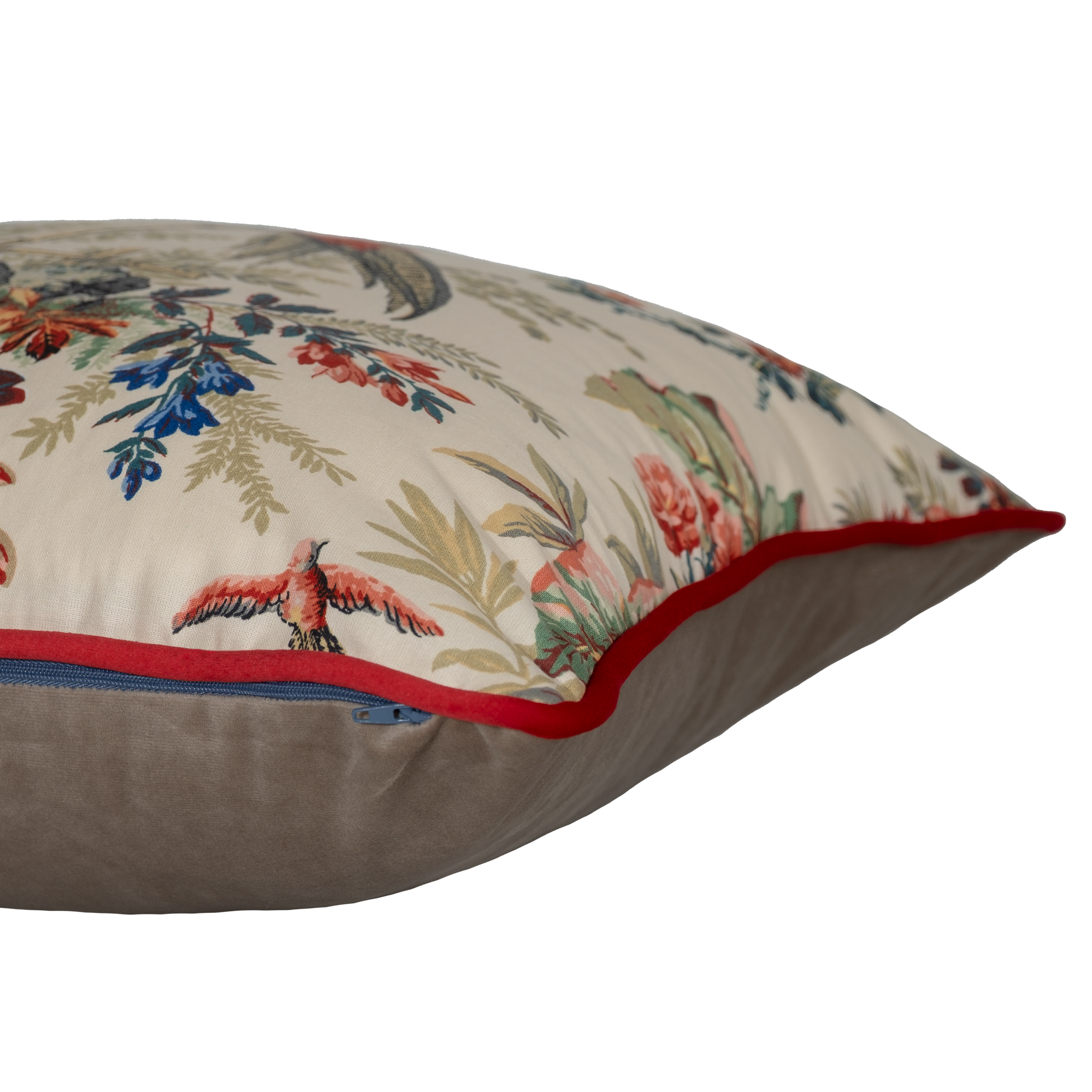 Decorative pillow with floral and bird pattern on a beige background