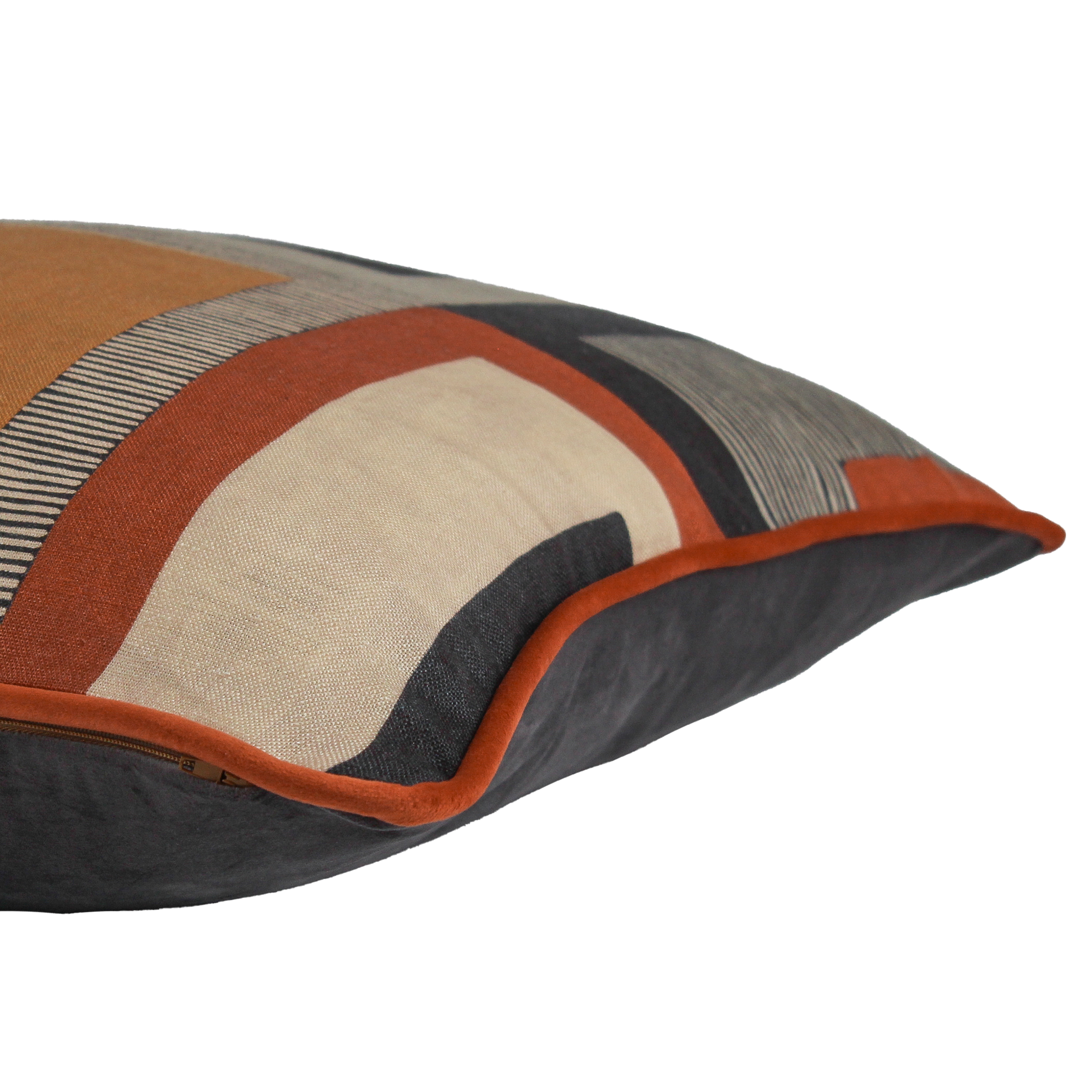 Side shot of a geometric linen cushion in black, rust, and tan linen