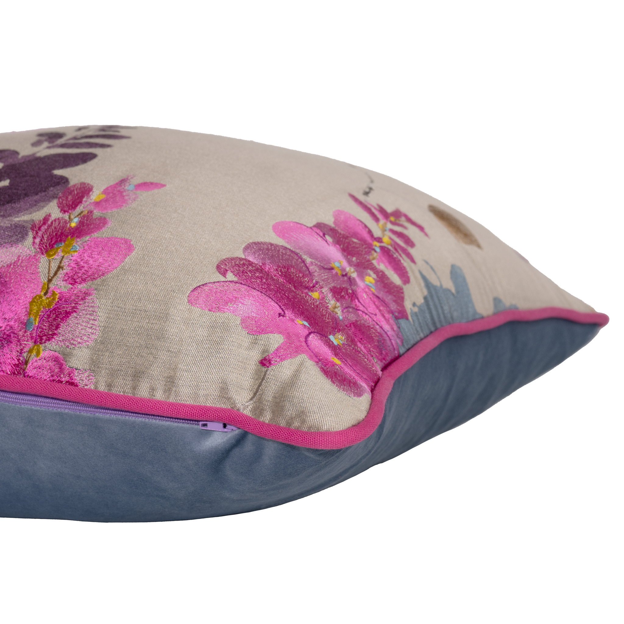 Decorative pillow with pink floral design on a beige background